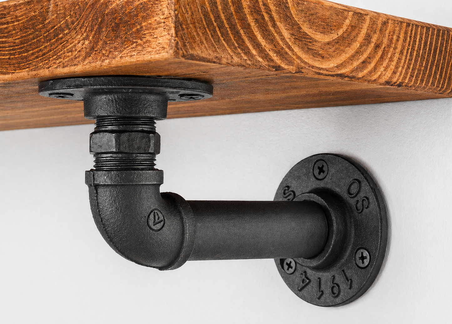Industrial pipe bracket shelf by Jay Jackson Furniture, featuring black metal pipes and wooden shelf for rustic storage.